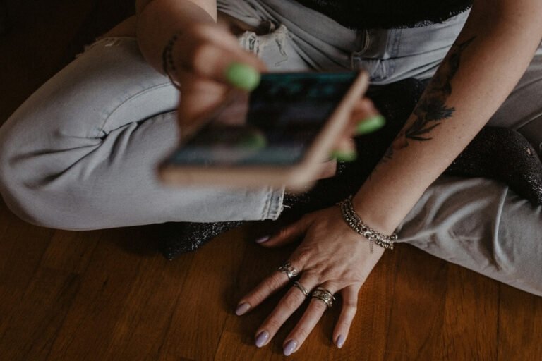 Mental health apps female using on her mobile phone